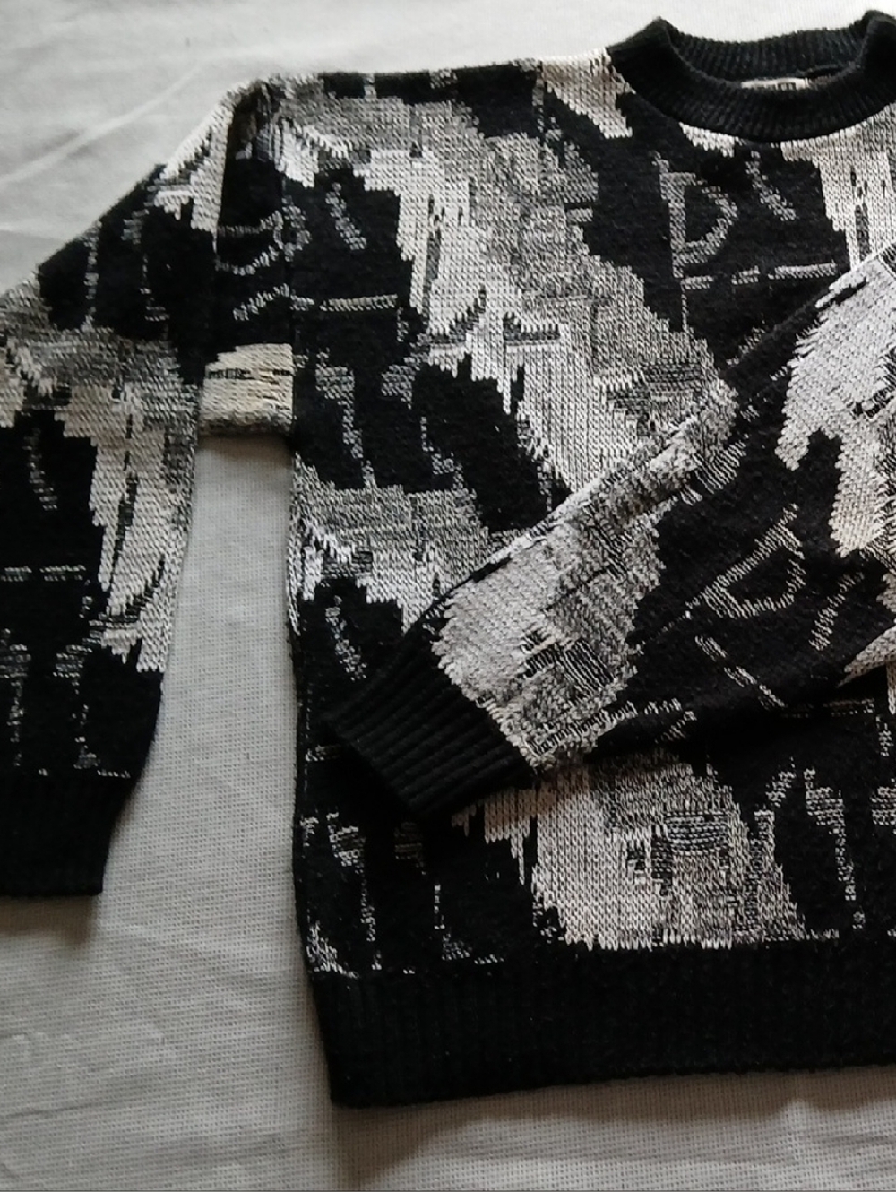 Men's Black and White Crewneck Sweater with Abstract Pattern